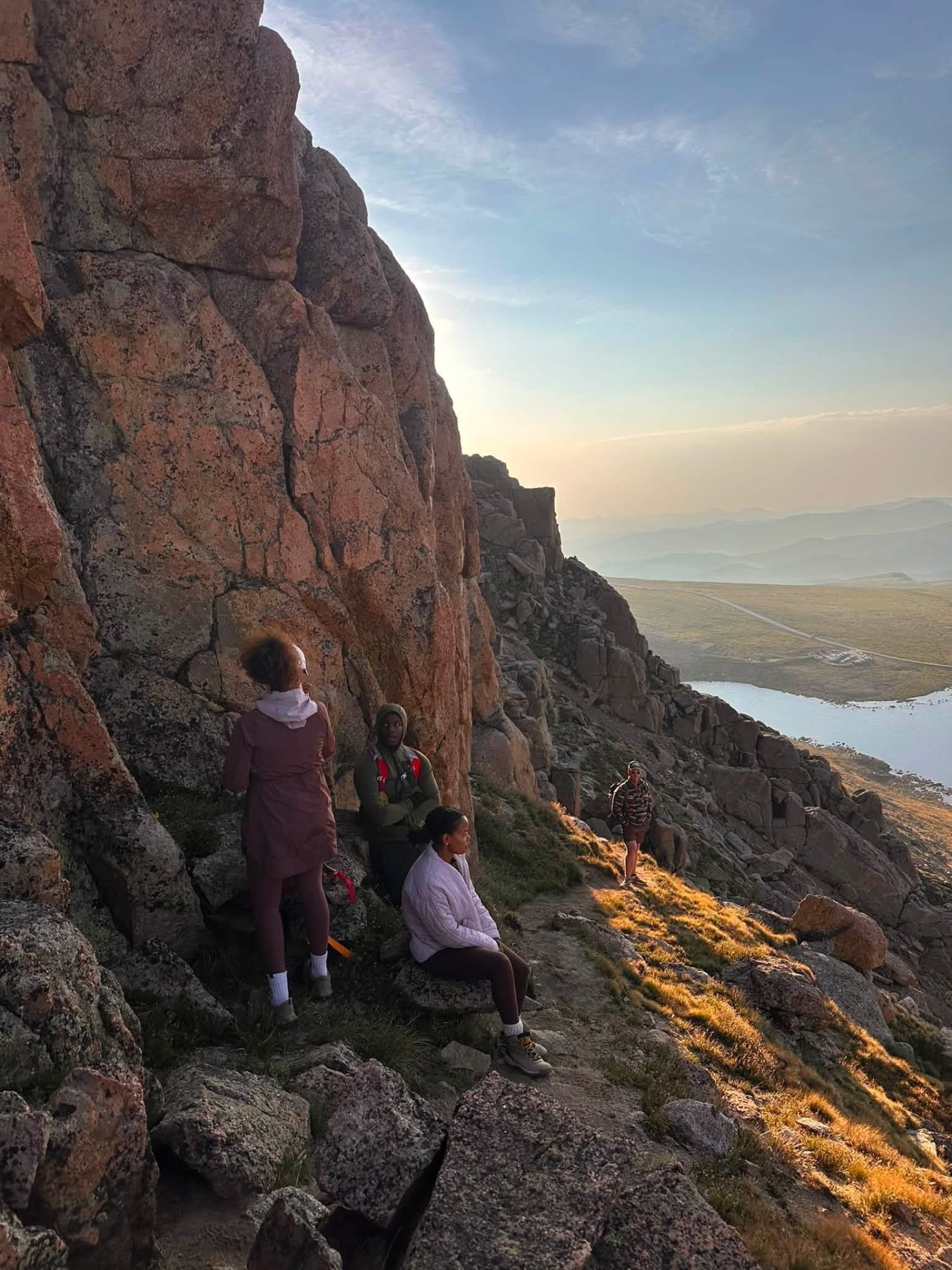 CECTENA members watching sunset from a Colorado mountain ledge